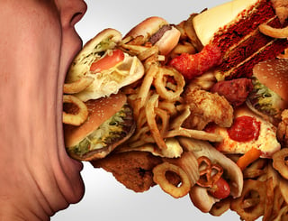 bigstock-Eating-Junk-Food-119381840.jpg
