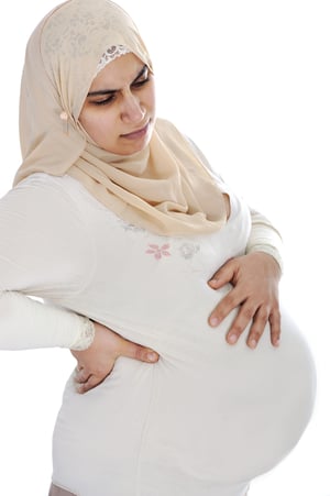 Muslim arabic pregnant woman with pain in back