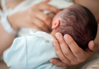 Newborn baby first days drinking breast milk