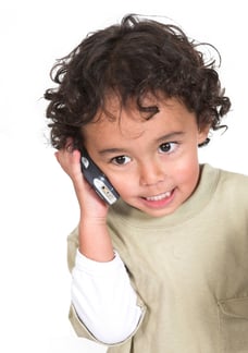 cute kid talking on the phone over white background-1