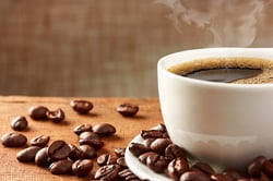 bigstock-Coffee-Cup-And-Coffee-Beans-84244856