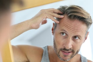 bigstock-Middle-aged-man-concerned-by-h-105776588.jpg